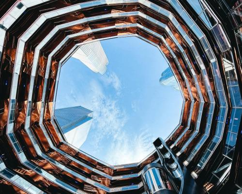 View from below looking up of the sky in an office building
