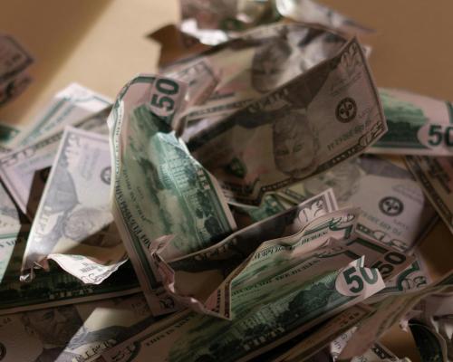 Us Dollar Bills Crumpled on the Floor