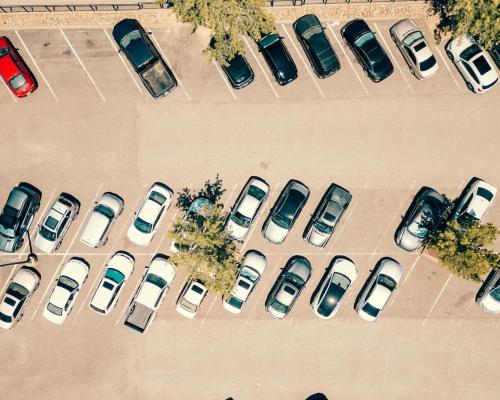 Aerial View of a Busy Parking Lot on Sunny Day