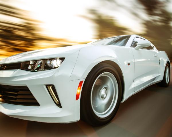 Close-Up Photography of White Chevrolet Camaro with the background blurred