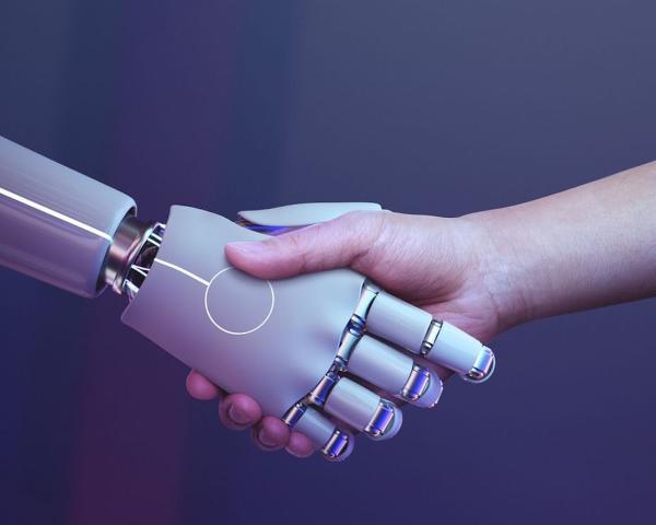 A robotic hand shaking a human hand against a blue/purple background
