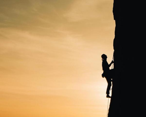 Person Rock Climbing