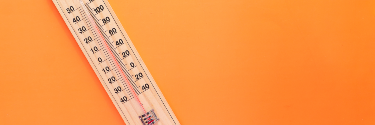 an orange background with a wooden thermometer reading 90 degrees farenheight on the left side