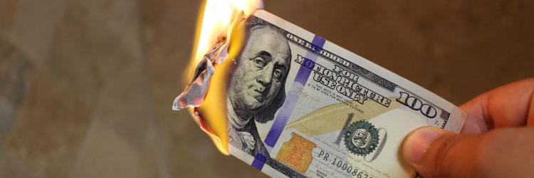 Hundred dollar bill on fire