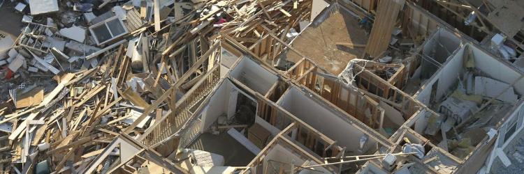 Overhead photo of a damaged and torn apart home