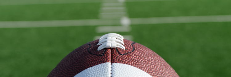 Football laying on field