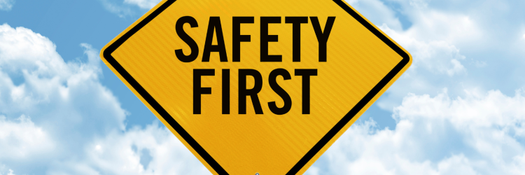 Yellow Diamond Traffic Sign that reads Safety First