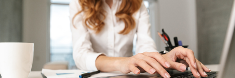 woman typing on laptop