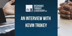 a banner reading "an interview with kevin trokey". The text is white on a blue background set against a photo of two people having a conversation.