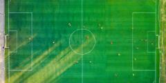 aerial view of a soccer field with players