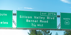 a road sign that reads Silicon Valley Blvd exit 377A 3/4 mile