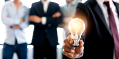 Man holding light bulb