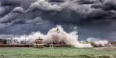 Boat and dock being hit by a strong wave