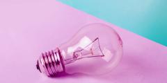 Light bulb on a pink and blue background