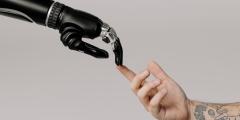 Bionic Hand and Human Hand Finger Pointing at each other