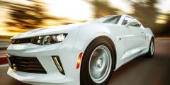 Close-Up Photography of White Chevrolet Camaro with the background blurred