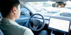 Man in Self Driving Car