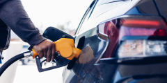 person pumping gas into their car